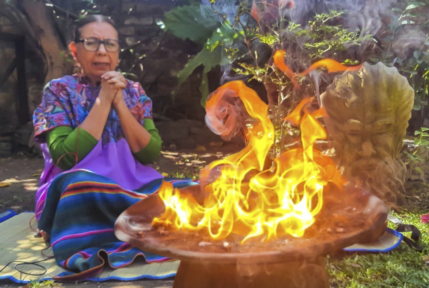 Abuela Maria Eugenia Aguilar is doing a xuculem or mayan fire ceremony for grounding and cleansing. For releasing doubts and suffering. 