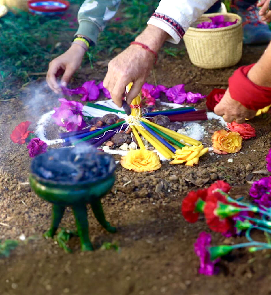 Group of people doing an equinox. ceremony offerinc sacred. To recieve the new cycle. doing a chamanic ceremony